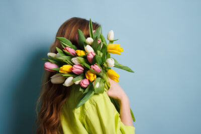 a women holding flowers